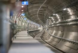 The inside of an under construction metro tunnel lined with precast concrete segments.