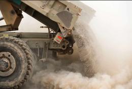 A tipper truck unloading sand