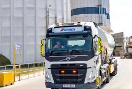 A cement mixer leaving a cement plant