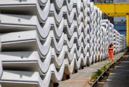 Precast concrete tunnel segments await transport to the construction site