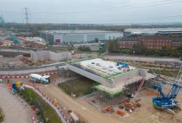 An aerial photo of an HS2 construction site showing a large concrete structure and a blue crane