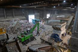 Inside SUEZ's recycling facility at Malpass Farm in Rugby, where Climafuel is produced in order to heat the kiln at Cemex's Rugby cement plant, a green material handler sorts waste
