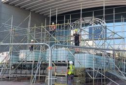 Men in PPE on a scaffolding system