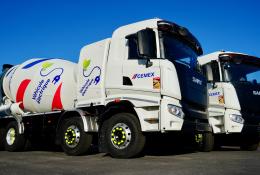 Two of Cemex's new electric trucks, which are designed for urban use, offering up to a 100% reduction in CO₂ emissions when powered by renewable energy and operate at significantly lower noise levels than traditional diesel-powered vehicles.