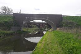 Three bridges - a new masonry clad bridge, with the original 18th century bridge and the new bridge seen through its span - on the River Ryton, in Nottinghamshire. Image: ABM Precast Solutions. 