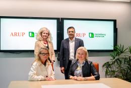 Signing the Memorandum of Understanding. Seated (left to right): Dame Jo da Silva (chief sustainable development officer, Arup), Dr Katharina Beumelburg (chief sustainability and new technologies officer, Heidelberg Materials); standing behind (left to right): Jemima Bruin-Bland, carbon capture and utilisation lead – UKIMEA, Arup), Mubarik Chowdhry (vice president global key account and product management evoZero, Heidelberg Materials)