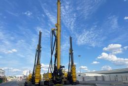 Three yellow piling rigs on a hard stand at RBL.