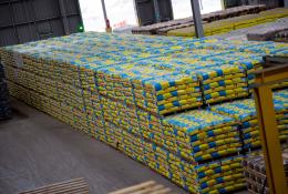 A pile of cement bags in a warehouse