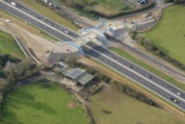 An aerial view of the Marazanvose green bridge spanning the new dual carriageway and old A30.