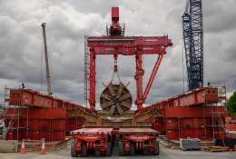The large, red TBM Emily’s cutterhead lifted at Green Park Way shaft following completion of Northolt Tunnel section