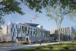 A red helicopter flies over the new Caen University Hospital, which features 110,000 m² of healthcare space built using lower-carbon concrete. Photo Credit: ©CHU de Caen Normandie