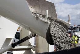 Concrete sliding off a delivery chute on a truck
