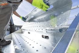 A close up of someone assembling PER UP's new "public stairs", which enable safe, high-footfall access across construction and infrastructure sites.