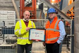 Chris Jones (right) of Mona Precast with David Wyke (left) of KVM, marking 25 years of block production at the Anglesey site.