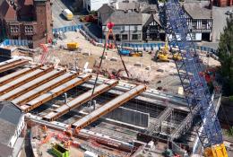 A blue crawler crane lifts Beam 9 into position at Greek Street last month (August, 2025).
