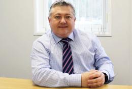 FPS chair Malcolm O’Sullivan sits at a desk facing the camera wearing a blue shirt and stripped tie. Malcolm has welcomed the £725bn infrastructure programme but warned of regulatory and workforce pressures.