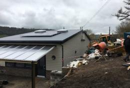 The incomplete concrete block retaining wall at Swainswick School collapsed after aggregate was placed against it.