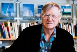 Sir Nicholas Grimshaw CBE PRA, 1939-2025 in his studio surrounded by books