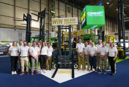 Combilift staff celebrate The 100,000th Combilift forklift, a golden Combi-CBE, was unveiled at IMHX 2025 in Birmingham.