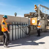 Two men working at CarbonCure's cDAC facility, US