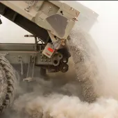 A tipper truck unloading sand
