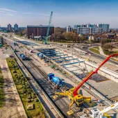An aerial view of Ashcourt Concrete's 1,200m³ concrete pour for the A63 underpass project in Hull, showing a blue crawler crane and a yellow and red concrete pump.