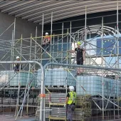 Men in PPE on a scaffolding system