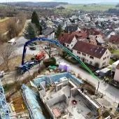 An aerial view of the new Volvo Trucks and Putzmeister fully electric alternative for pumping concrete in action on a construction site. 