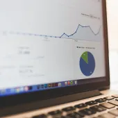 Analytics graphs on a MacBook screen by Luis Llerena / Creative Commons