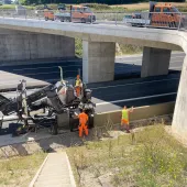 Wirtgen's SP 33 slipform paver, unveiled at World of Concrete 2025 (21-23 Jan), Las Vegas, US, before getting its European debut at this year's bauma (7-13 Apr) in Munich, Germany, working under a concrete bridge on a motorway.