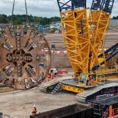 The 120-tonne, 8.62-metre diameter cutterhead of TBM Mary Ann being lifted from a 22-metre-deep portal at Washwood Heath using a 700-tonne crawler crane