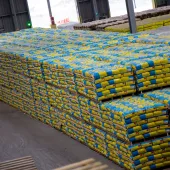 A pile of cement bags in a warehouse
