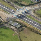An aerial view of the Marazanvose green bridge spanning the new dual carriageway and old A30.