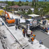 An aerial view of a road building project in Thailand showing Wirtgen’s SP 64 slipform paver installing reinforced concrete highways without the need for fixed formwork.