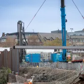 A blue piling rig installing sheet piles for the £4.4 million Rotherham Riverside upgrade