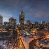 The Montréal towards sunset with a ligh dusting of snow covering the ground
