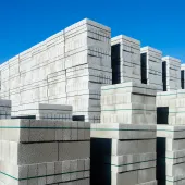 Neat, banded stacks of Cemex’s ReadyBlock Lite concrete blocks, which are designed for easier handling, lower carbon and improved thermal performance.