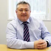 FPS chair Malcolm O’Sullivan sits at a desk facing the camera wearing a blue shirt and stripped tie. Malcolm has welcomed the £725bn infrastructure programme but warned of regulatory and workforce pressures.