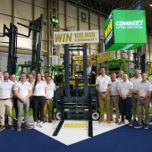 Combilift staff celebrate The 100,000th Combilift forklift, a golden Combi-CBE, was unveiled at IMHX 2025 in Birmingham.