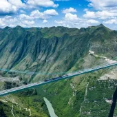 The Huajiang Grand Canyon Bridge in Guizhou Province opened in September 2025, setting records for height and span. Image: CREC.