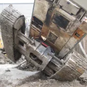The underside of a toppled, tracked piling rig