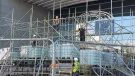 Men in PPE on a scaffolding system