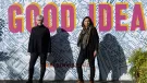 Ruth Sparkes and Sunita Gordon, co-founders of SaferSpace, dressed in black, photographed in harsh sunlight against a map of London with the slogan "Good Idea" printed over it.