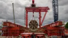 The large, red TBM Emily’s cutterhead lifted at Green Park Way shaft following completion of Northolt Tunnel section