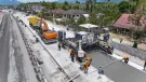 An aerial view of a road building project in Thailand showing Wirtgen’s SP 64 slipform paver installing reinforced concrete highways without the need for fixed formwork.