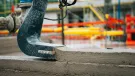 The Instatiq P1 printer head applying solid concrete walls directly on site, cutting build time and emissions.