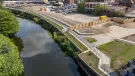 An aerial view of the completed riverside walkway in Rotherham links Water Lane to the town centre, supported by new sheet piling and concrete capping beams.