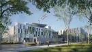 A red helicopter flies over the new Caen University Hospital, which features 110,000 m² of healthcare space built using lower-carbon concrete. Photo Credit: ©CHU de Caen Normandie