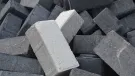 a pile of differently coloured concrete blocks.
