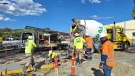 Men in PPE on a construction site where Boral has trialled the use of recarbonated recycled aggregates in its low-carbon Envisia concrete